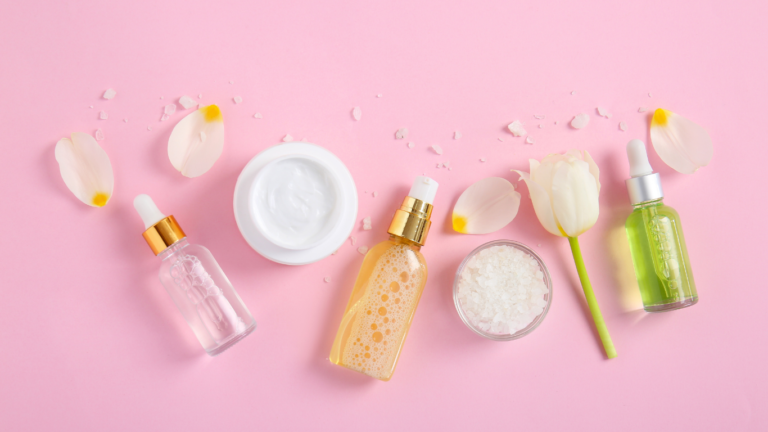 Skincare products for women, in a pink background